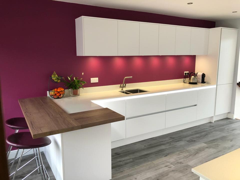   A modern design accentuated by a burgundy feature wall